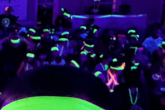 headbands and scrunchies glowing at a black light oarty
